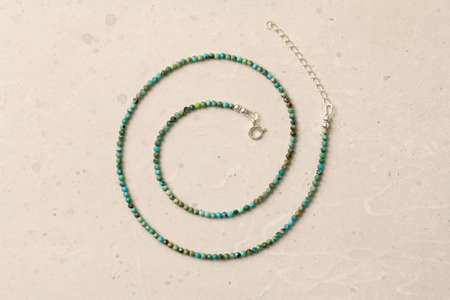 Thin Turquoise necklace. A short necklace made of natural turquoise stones. Handmade jewelry made from natural stones. Modern jewelry. Natural turquoise choker.の写真素材
