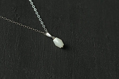 White jade nephritis natural pendant, necklace. Short necklace made of nephritis. Handmade jewelry made natural stones. Modern Author's jewelry. Natural White jade nephritis pendant on silver chain.の写真素材