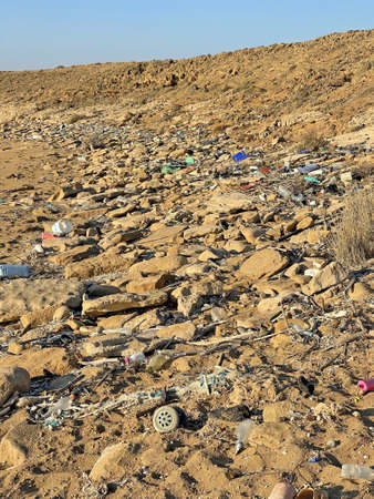 A lot of plastic, garbage and waste lies on the seashore and on the beach. Environmental disaster in nature. Environmental pollution in North Cyprus.の写真素材