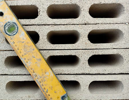 Oblique dirty yellow ruler on blocks with hole.