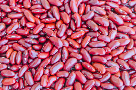 Uncooked peeled dry red kidney beans closeup for background.の写真素材