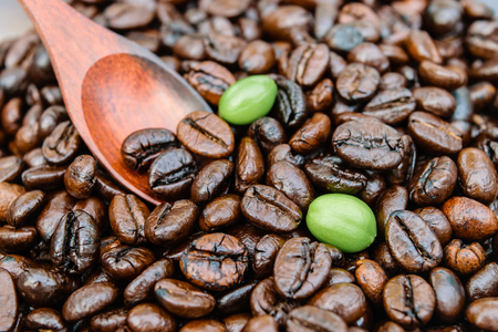 coffee beans with wooden spoonの写真素材