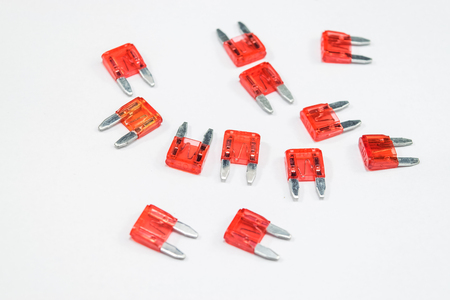 Electrical automotive fuses for car on white backgroundの写真素材