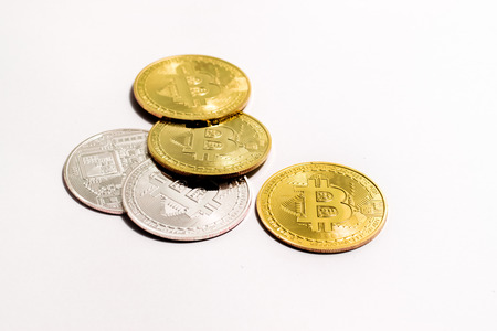 crypto currency golden and white bitcoin isolated on white background.の写真素材