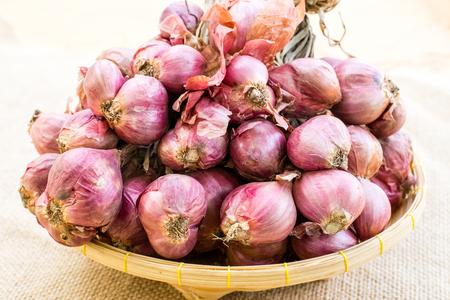 shallot and garlic on the hemp sack background.の写真素材