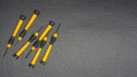 Camera lens reparation with screwdrivers, repair conceptの写真素材