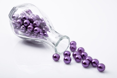 Purple beadl in the glass bottleの写真素材