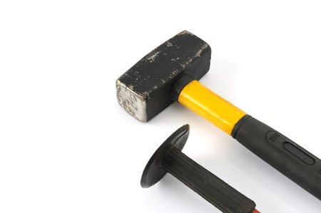 Hammer and chisel on a white background