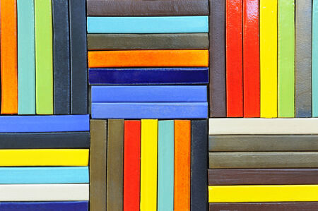 Multi-colored cement sheets arranged into a wall.の写真素材