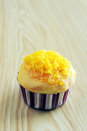 Golden cupcake and toppingの写真素材
