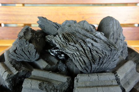 The burned wood becomes black charcoal for fuel.の写真素材