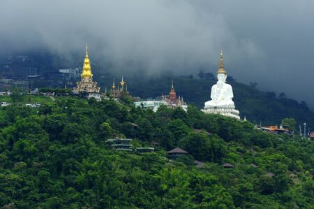 White buddha statue at Wat Phra That Pha Son Kaew in Thailand.