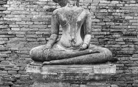 Old headless broken buddha statue at Ayutthaya Thailand in black and whiteの写真素材