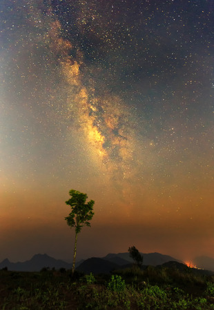 The milky way over the mountainの写真素材