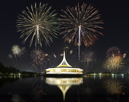 A lighting buiding with Beautiful Fireworks for celebration at twilight time in Bangkok, Thailandのeditorial素材