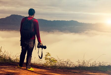 Nature photographer taking photos in the mountains