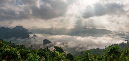 Landscape misty panorama. Fantastic dreamy sunrise on the mountains with a beautiful view. Foggy...