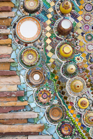 The pillar made of brick, glass and ceramic in Thai temple.の写真素材