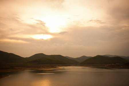 Sunset over the mountain hillsの写真素材