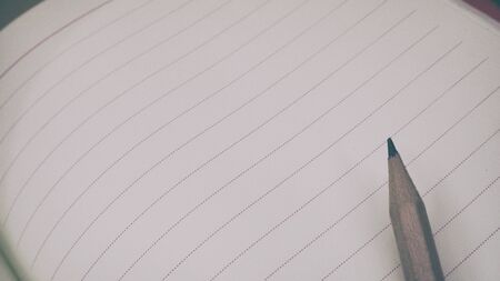 Wooden pencils and blank diaryの写真素材