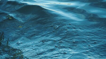 Water waves that hit the coastの写真素材