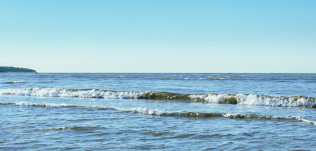 Calm ocean waves on a clear day sea and horizon image of sea waves and sky