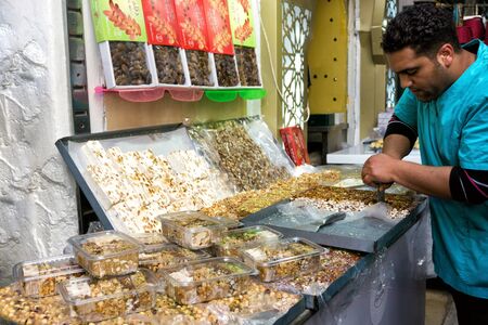 TUNIS, TUNISIA- APRIL 2: Traditional sweets for sale in a street market in Tunis, Tunisia on April 2, 2018のeditorial素材