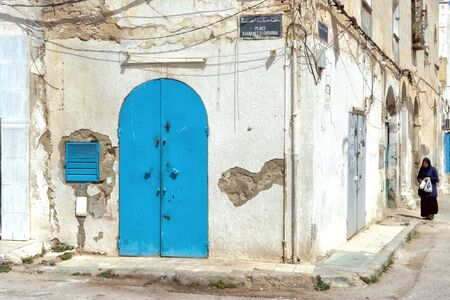 SOUSSE, TUNISIA - APRIL 9: Woman walks on the street of the medina in Sousse, Tunisia on April 9, 2018.のeditorial素材
