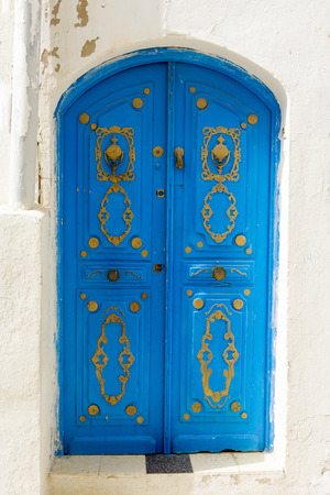 Entrance with blue traditional  doors in Sousse, Tunisia.の写真素材