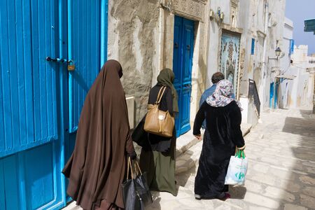 SOUSSE, TUNISIA - APRIL 8: Women walk in the street of the medina in Sousse, Tunisia on April 8, 2018.のeditorial素材