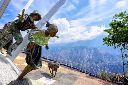 SANTANDER, COLOMBIA -JANUARY 19: Sculptures of man, woman, and dog with background of the Chicamocha Canyon in Panachi in Santander, Colombia on January 16, 2019のeditorial素材