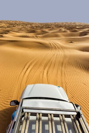 View of the Sahara desert from a car hood in Tunisia
