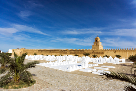Landscape of the Ouled Farhane Cemetery with the Great Mosque in Kairouan, Tunisia.の写真素材