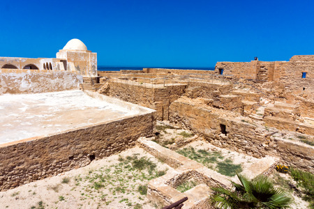 Borj el Kebir Castle with background of Mediterranean sea in Houmt El Souk in Djerba, Tunisiaの写真素材