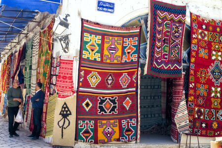 DJERBA, TUNISIA- APRIL 16: Variety of traditional carpets for sale on the street in Houmt El Souk in Djerba, Tunisia on April 16, 2018.のeditorial素材
