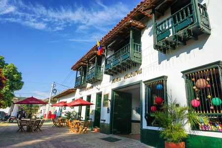 CURITI, COLOMBIA - FEBRUARY 22: Colorful street with variety of of traditional stores in Curiti, Santander, Colombia on February 22, 2019のeditorial素材