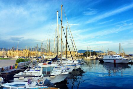 View of the Palermo Harbor with boats and the city in the background in Sicily, Italyの写真素材