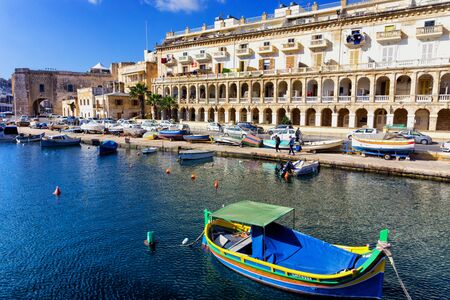 COSPICUA, MALTA - MAY 4: View of the Cospicua waterfront with traditional Maltese Dghajsa water taxi boats in Malta on May 4, 2018のeditorial素材