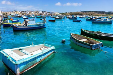 Traditional boats in the Mediterranean fishing Marsaxlokk in Maltaの写真素材