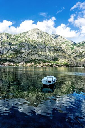 Boat and mountain in Bay of Kotor in Montenegroの写真素材