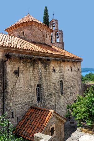 The Holy Trinity Church of the Praskvica Monastery surrounded by the scenic garden, Celobrdo, Montenegroの写真素材