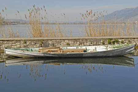reflection of the boat on the waterの写真素材