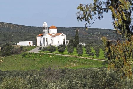 orthodox church and olive trees as backgroundの写真素材