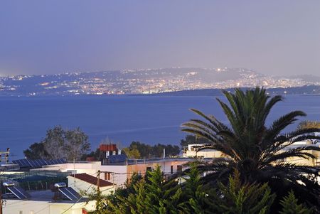 bay of Chania by night with the town as backgroundの写真素材