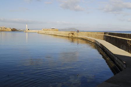 walking to the lighthouse over the wall の写真素材