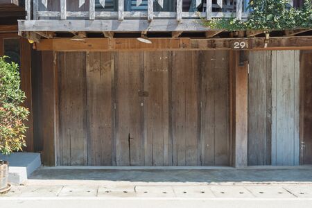 vintage wood door background. Old Style Wooden Door in Thailand.の写真素材