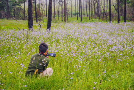 Photographer taking pictures of nature