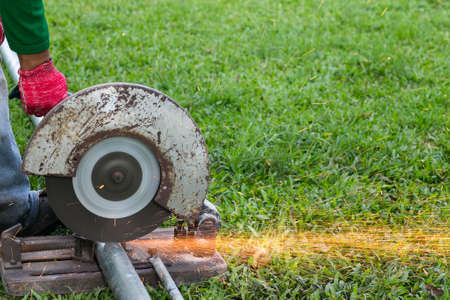 Technicians are grinding steel.