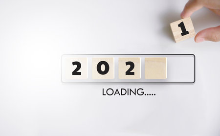 Loading with hand putting wood cube in progress bar.