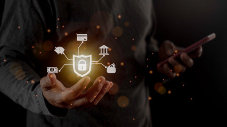 Businessman holding light icon social security network connection with shield guard to protected from cyber attacks. Network security system conceptの写真素材